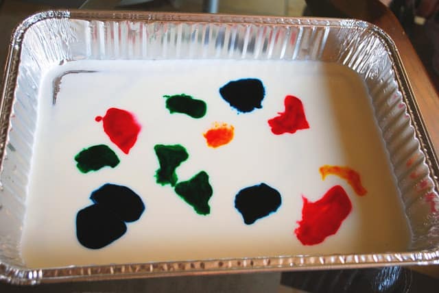 milk in tray with food coloring