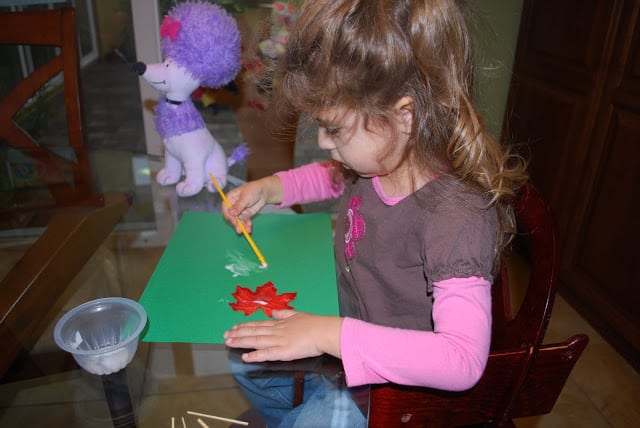 kids making leaf people