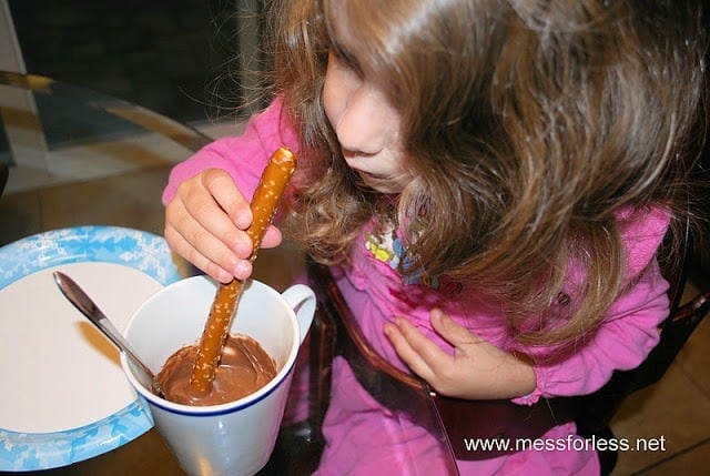 dipping pretzel in chocolate