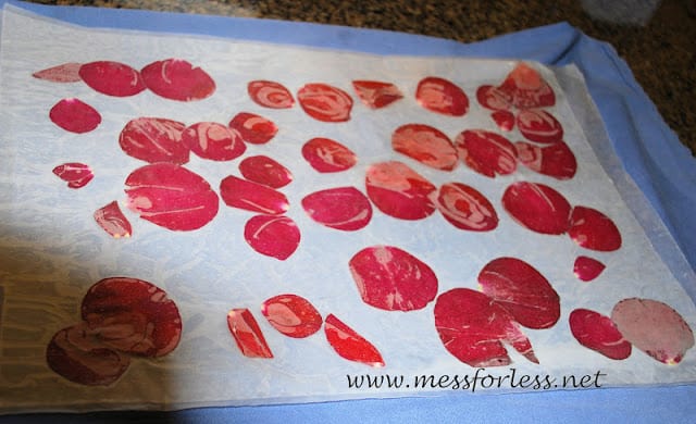 rose petals being ironed on wax paper