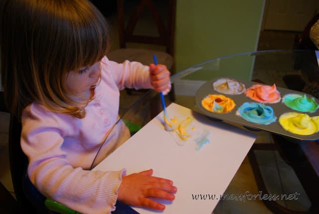 child painting with shaving cream