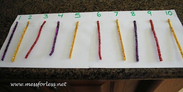pipe cleaners on paper with numbers