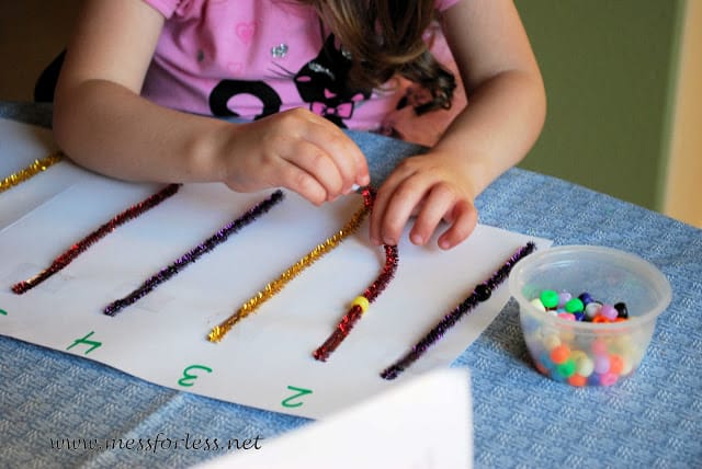 child string beads on pipe cleaners