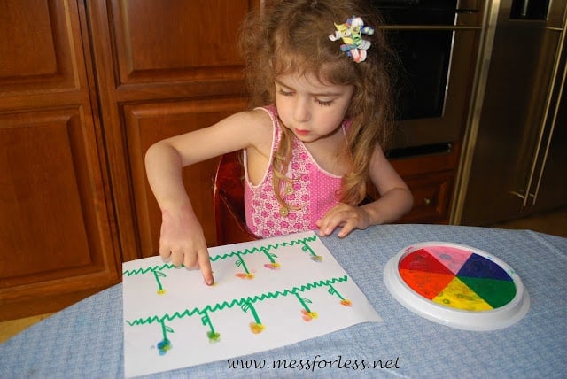 child making finger print stamps