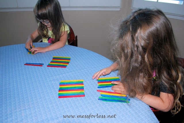 kids making popsicle stick patterns