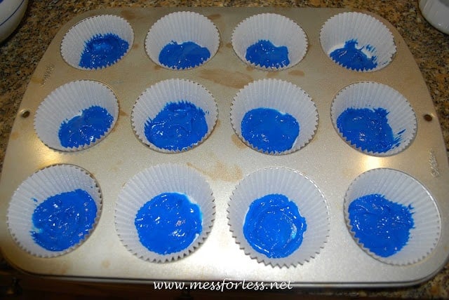 cupcake liners with blue batter in them
