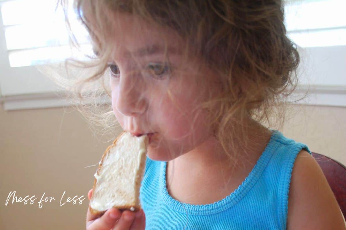child eating bread with butter