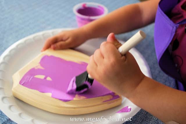 child painting wood purple