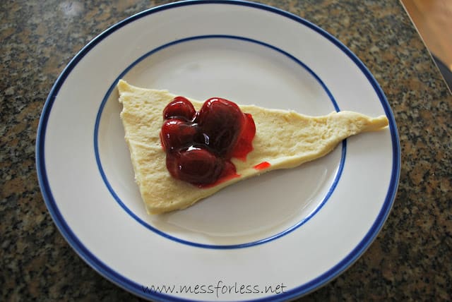 crescent roll with strawberries on it