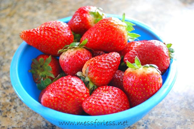 strawberries in blue bowl