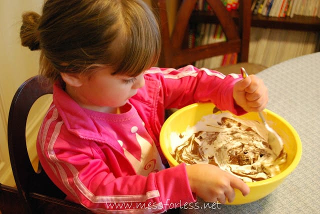 child stirring mix in a bowl
