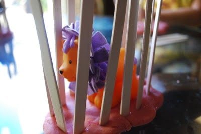 play dough spopsicle sticks and plastic animal