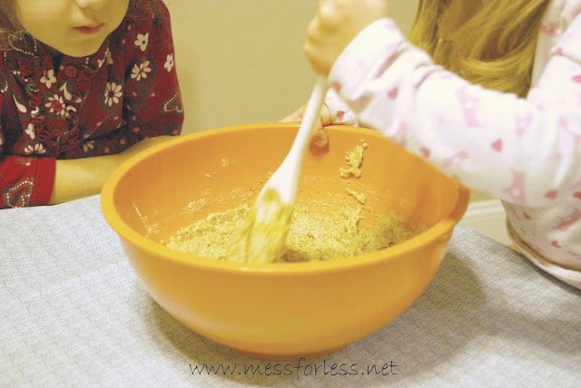 child stirring cookie batter