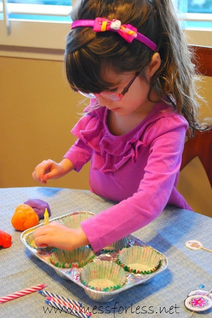 child playing with playdough