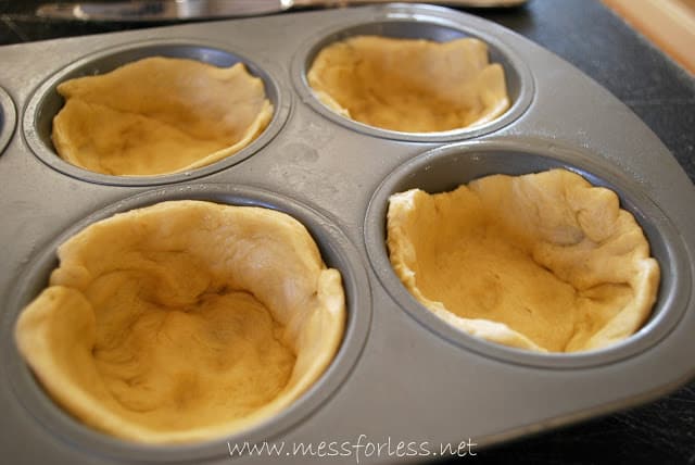 crescent roll dough in muffin pan