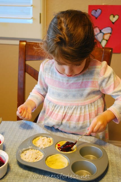 child making fruit filled crescent cups