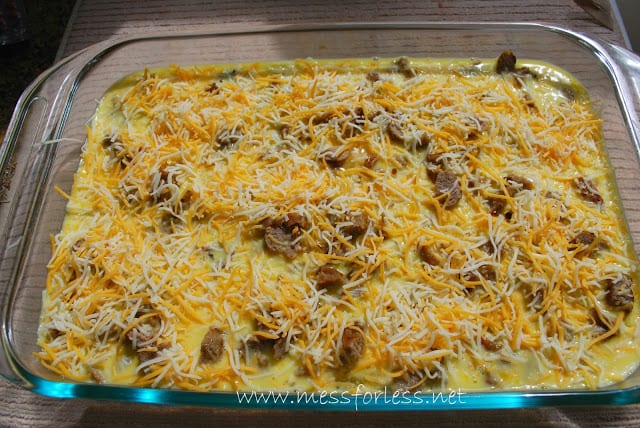 raw, eggs, sausage and cheese in casserole dish