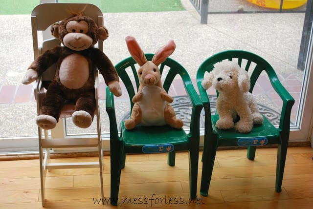 stuffed animals in chairs