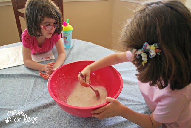 kids mixing ingredients for bread