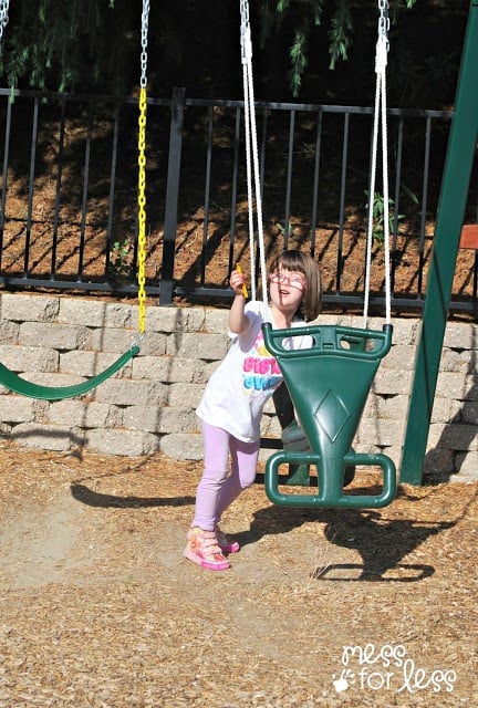 child playing with swing