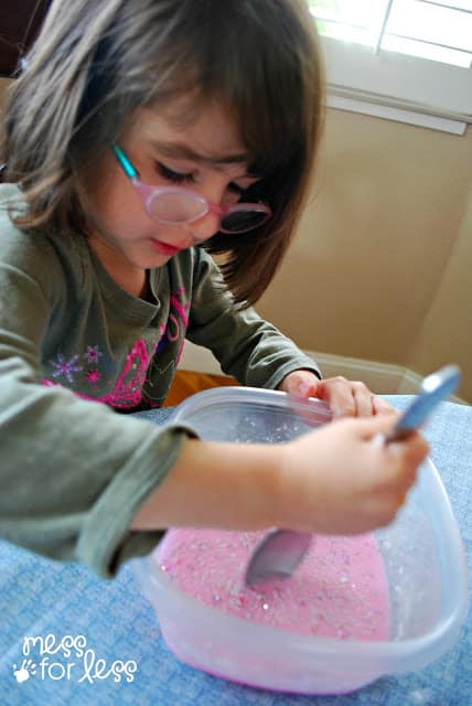 Child playing with oobleck