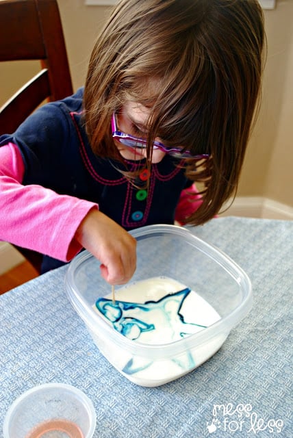 mixing food coloring and milk