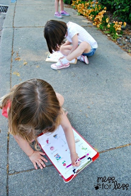 kids writing on clipboards
