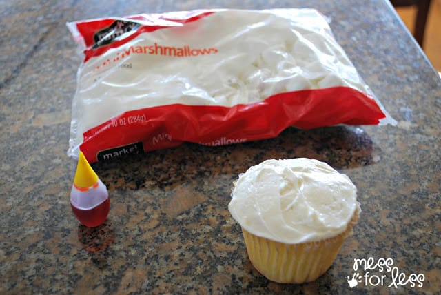 frosted cupcake, food coloring and marshmallows