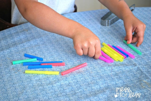 child counting straws