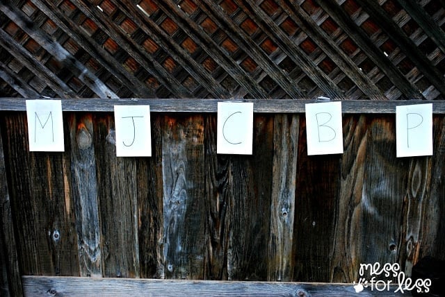 cards with letters hung on fence