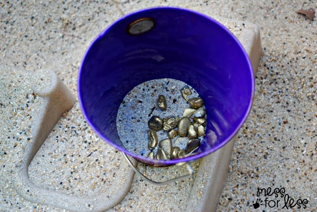 gold rocks in a bucket