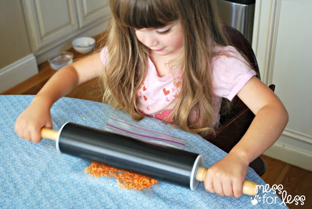 crushing cereal with rolling pin