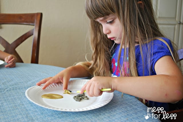 Child painting rocks