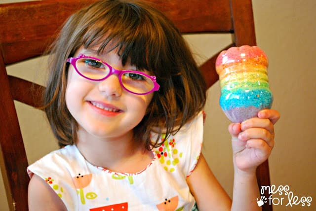 child holding Crushed Cereal bottle