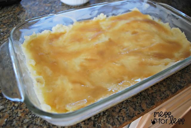 mashed potatoes with gravy in a casserole dish