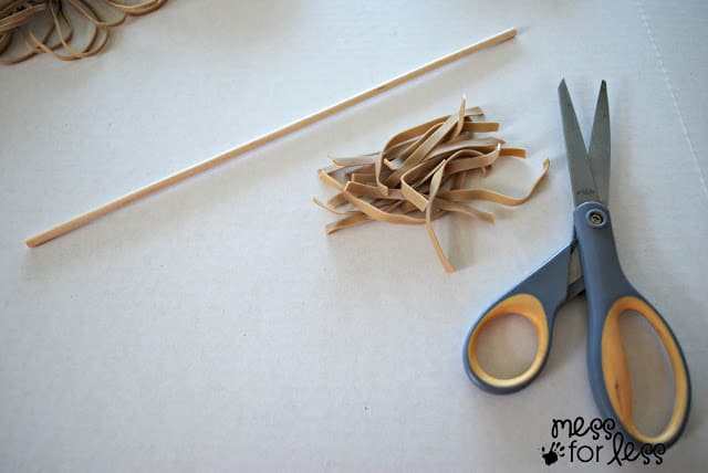 scissors, cut rubber bands and dowel