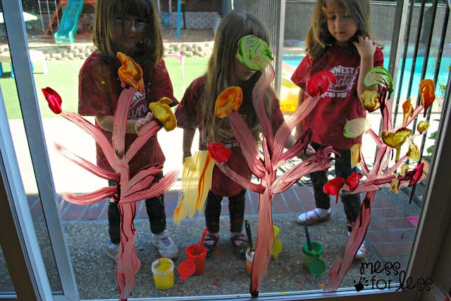 Painting Fall trees on a window