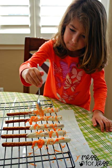 child make chocolate covered pretzels