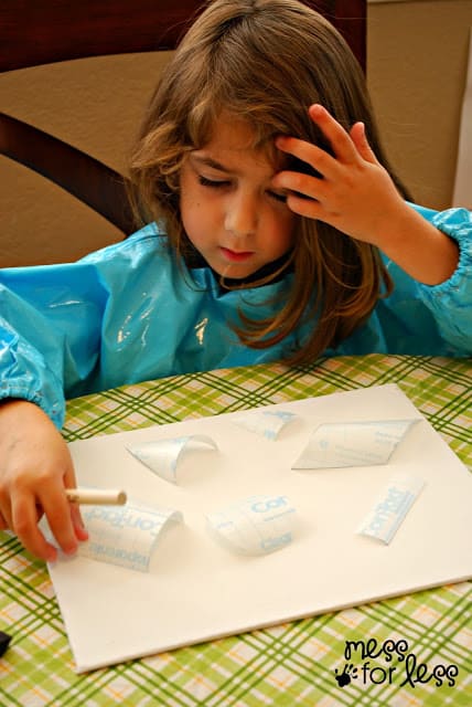 child with paint canvas