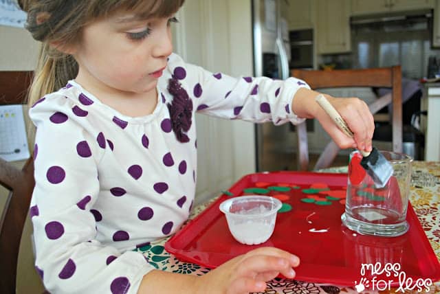 decorating a Christmas craft