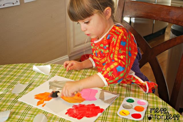 child painting a canvas