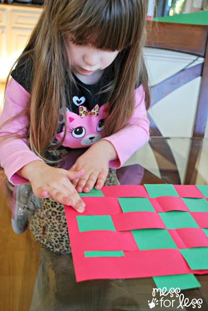 child making a place mat