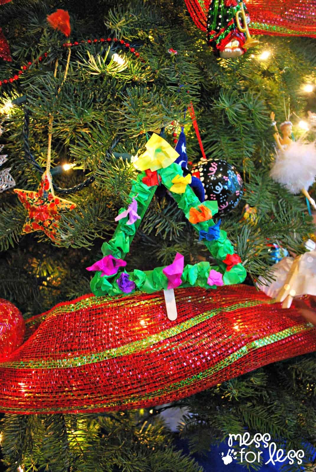 Christmas tree ornament - so simple to make using popsicle sticks and tissue paper. 