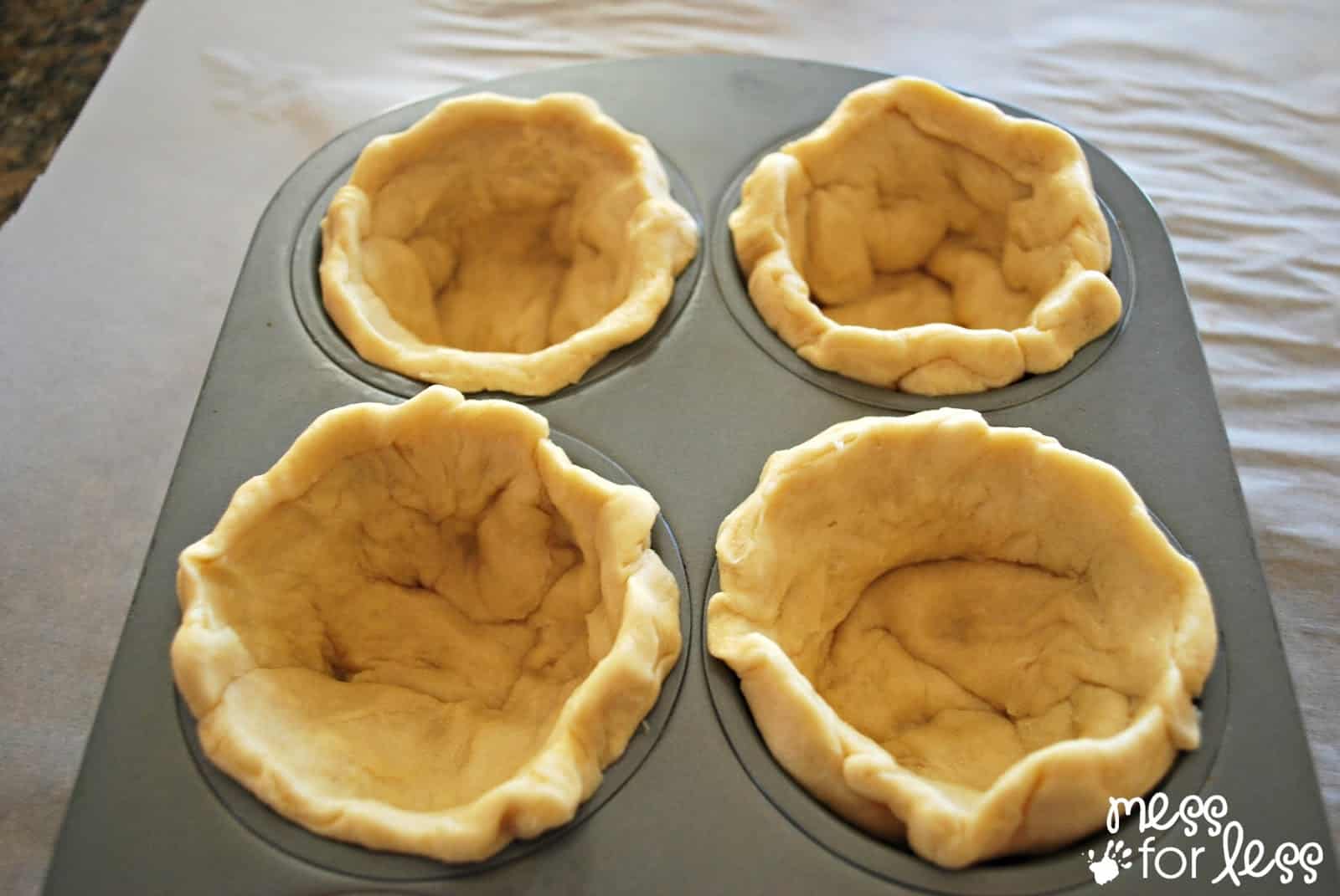 crescent dough in a muffin tin