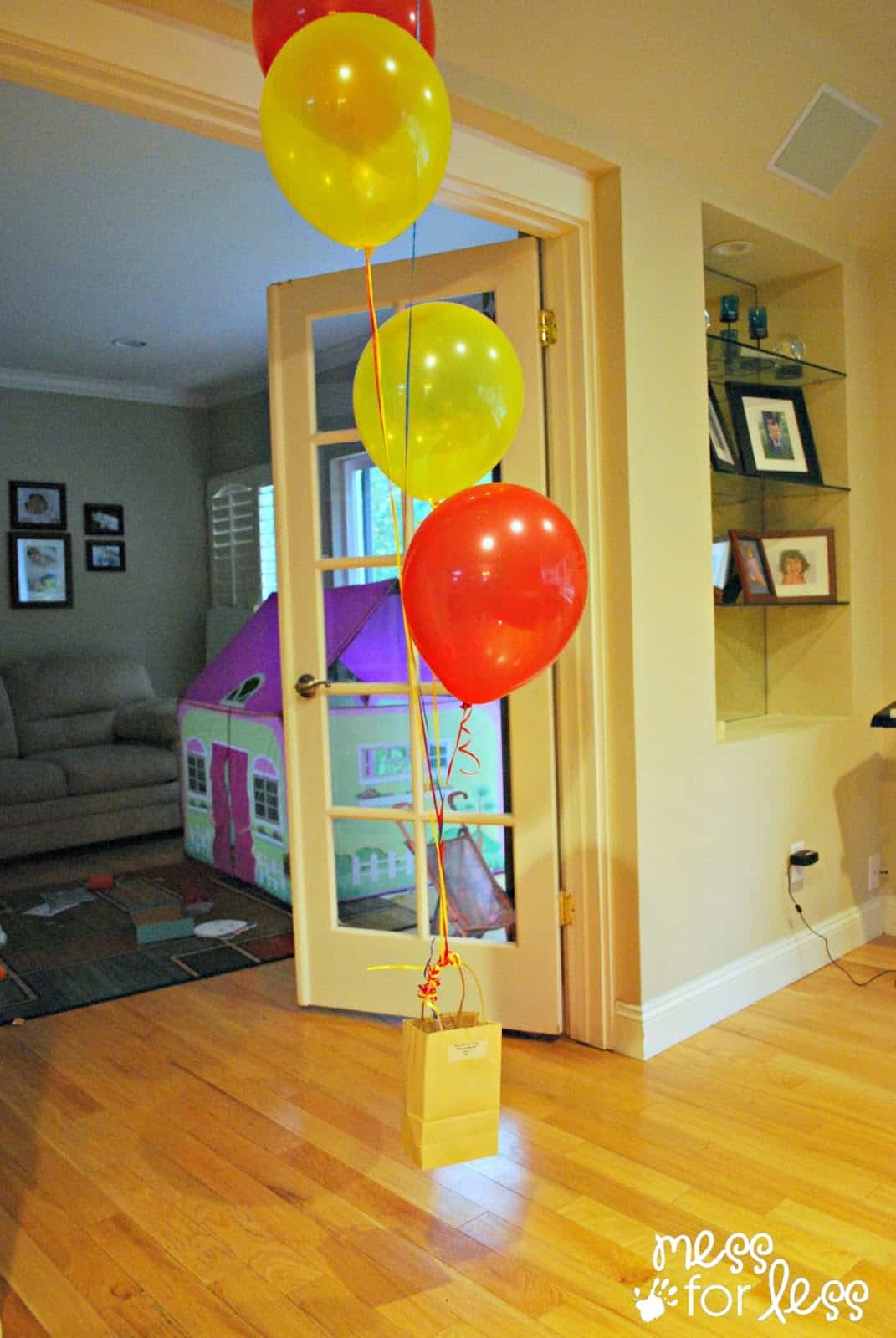 balloons lifting a bag off the ground