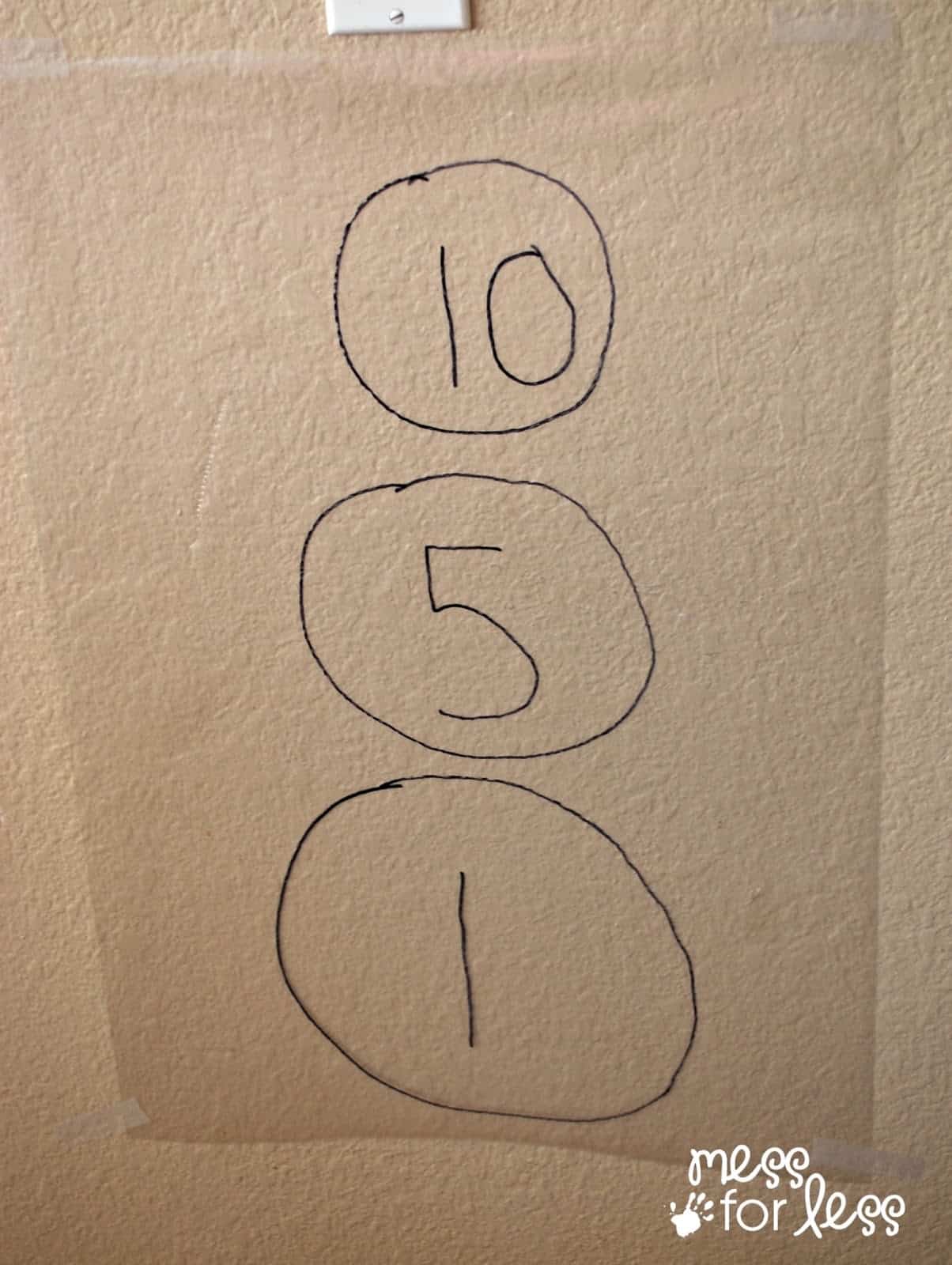 contact paper hanging on a wall with numbers on it