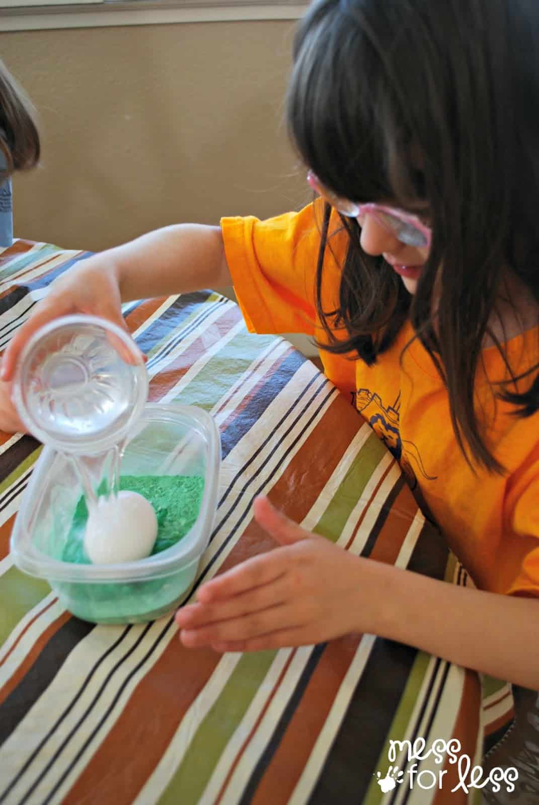 pouring water over an egg
