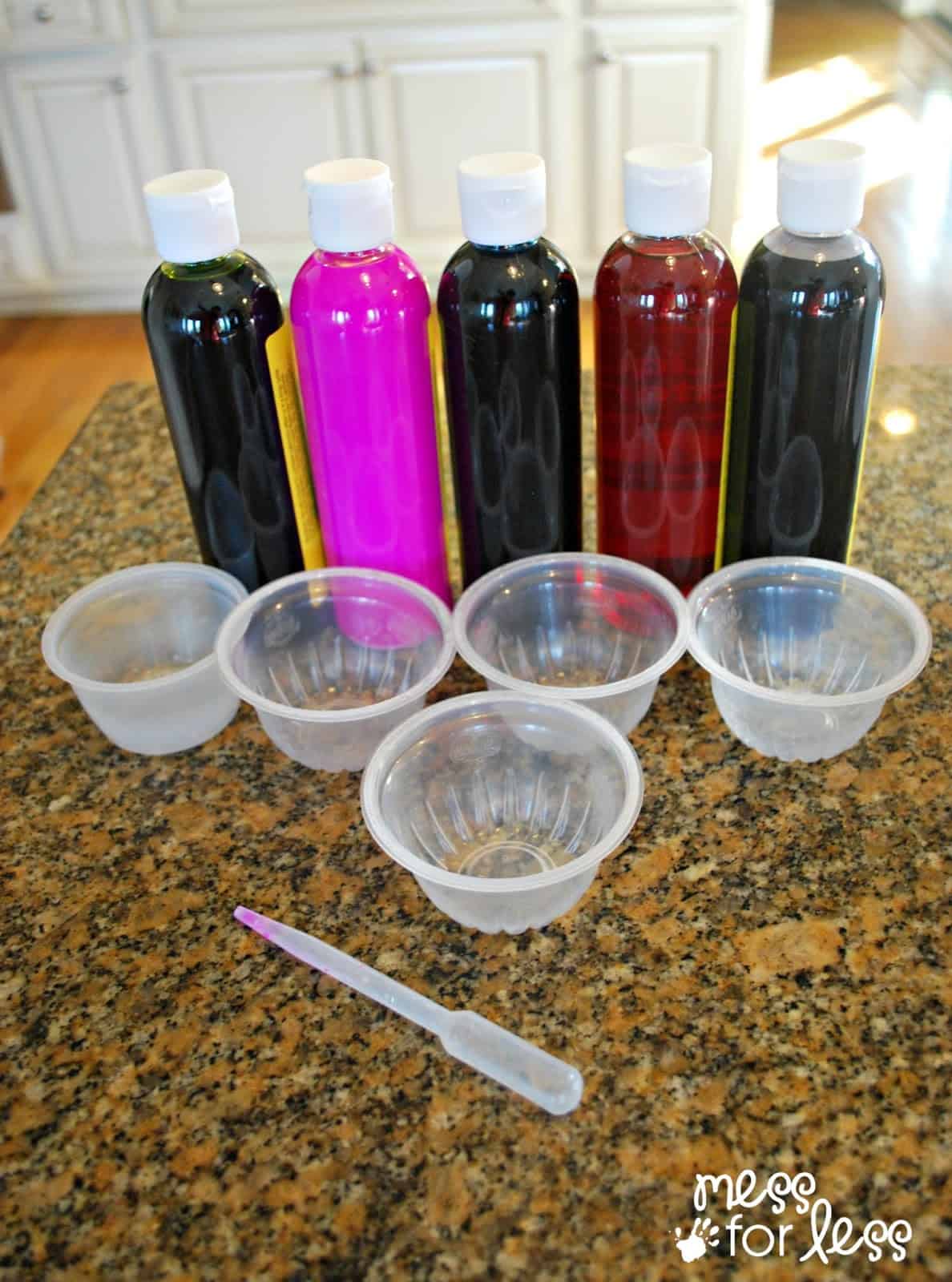 Liquid watercolors, cups and a dropper.