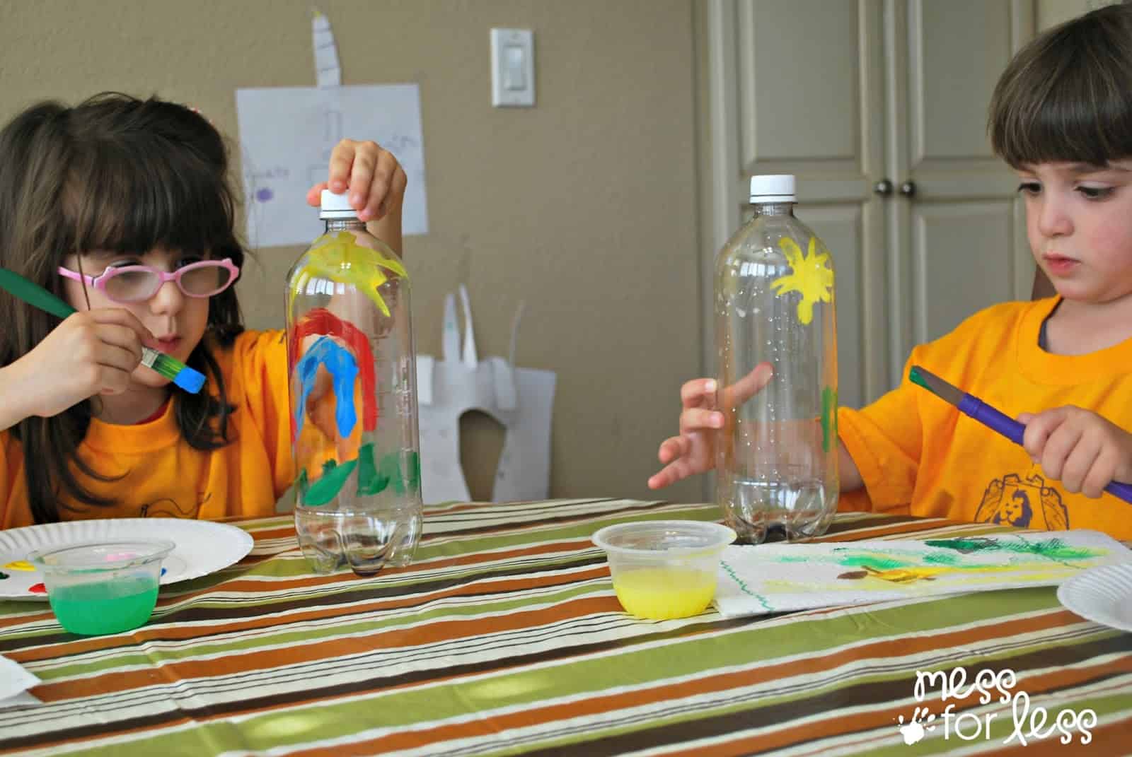 kids painting plastic bottles