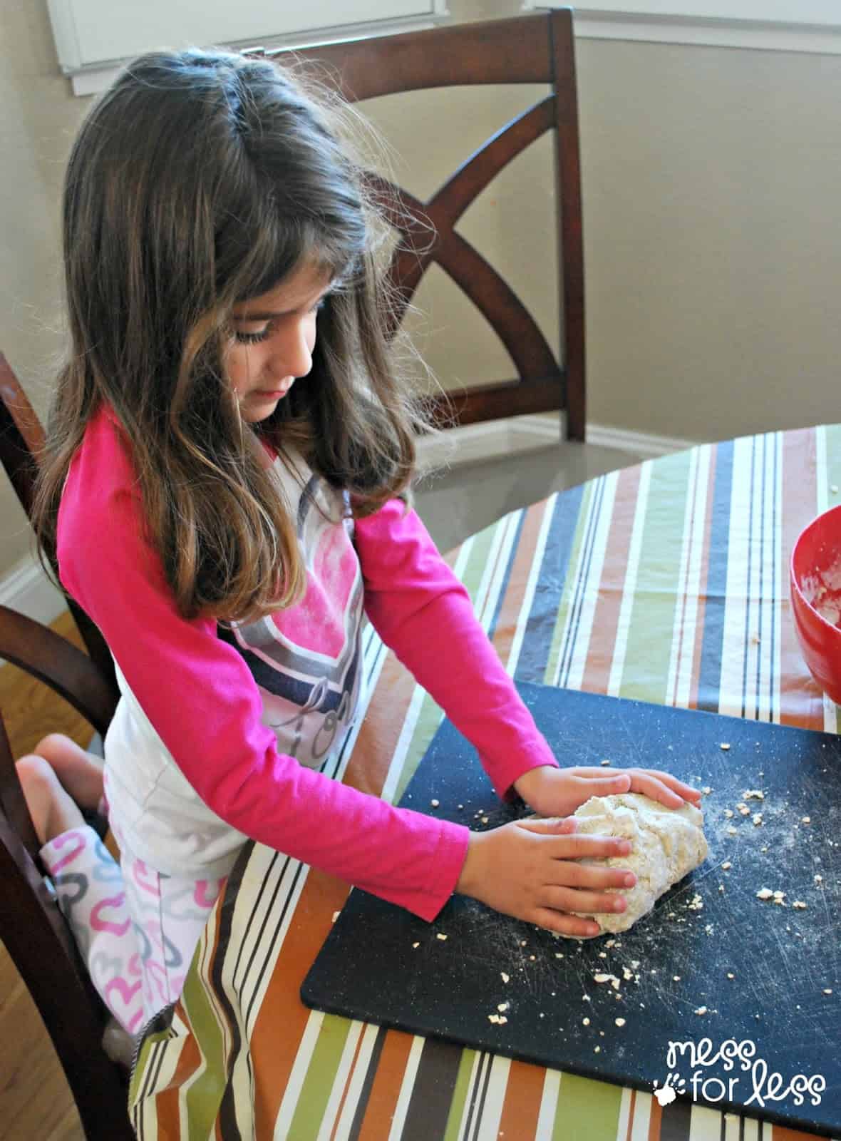 child playing with oatmeal playdough
